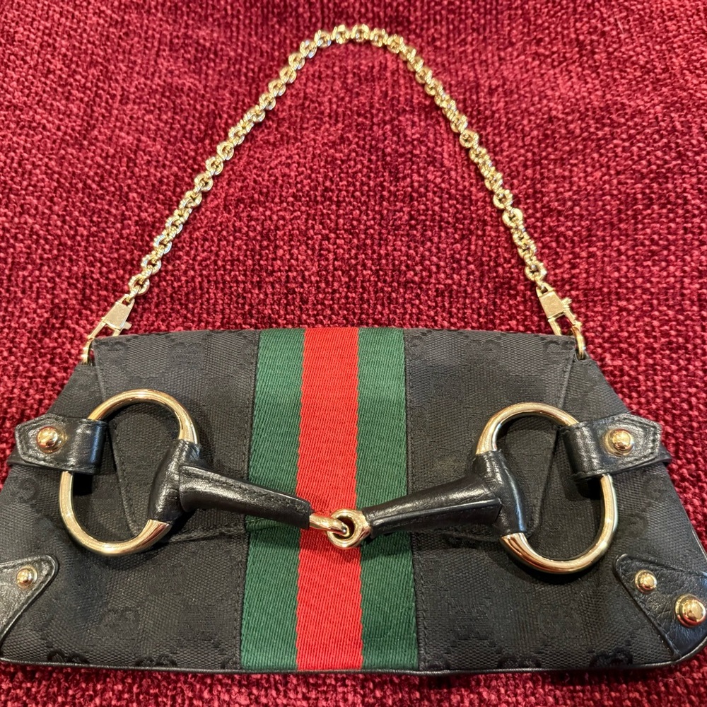 Gucci Black and Gold Clutch with Chain Strap and Elegant Design